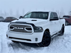 White Ram 1500 Sport truck on a snowy lot